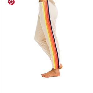 Beige aviator nation pants with rainbow stripe